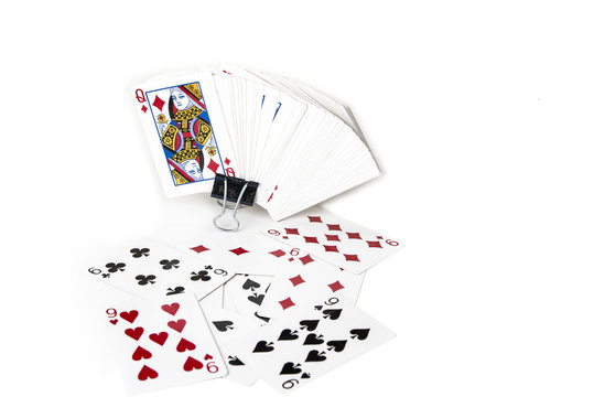 Playing cards spreaded on the white background