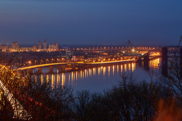 Fototapeta na wymiar Beautiful View of the Dnieper river, River station, Havana bridge and Naberezhno-Kreschatitska street in Kiev, Ukraine.