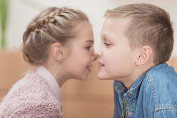 kids talking on close distance of each other at cafe