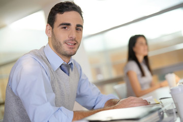 Portrait of young businessman working in office