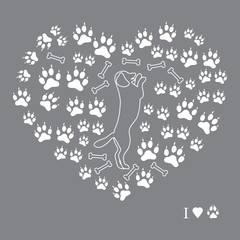 Nice picture of dog standing on its hind legs silhouette on a background of dog tracks and bones in the form of heart.