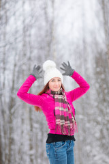 Happy winter women in park snow Christmas lights