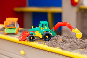 children's toys in the sandbox close-up
