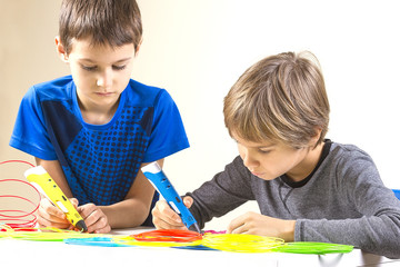 Children creating with 3d printing pen