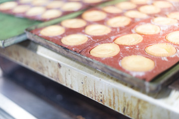 Preparing sweets , working out the dough and baking pastry in the bakery