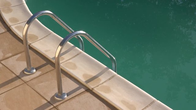 Swimming pool ladder, outdoor poolside