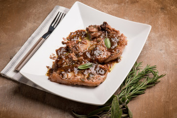 steak cooked on red wine and mixed herbs