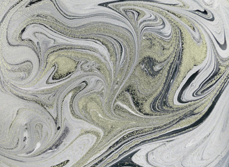 Marble abstract acrylic background. Nature marbling artwork texture. Golden glitter.