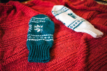 Two knitted mittens.