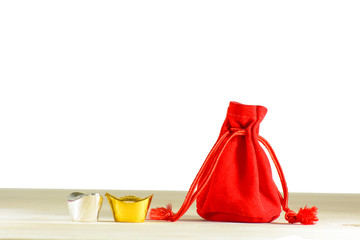 Red gift bag, gold and silver of The Merry Christmas & A Happy New Year Festival on a wooden floor.