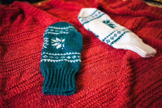 Two knitted mittens.