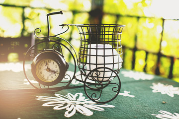 Home interior decor in black and green color : Clock Classic Bicycle Curved steel, Table decoration, vintage tone 