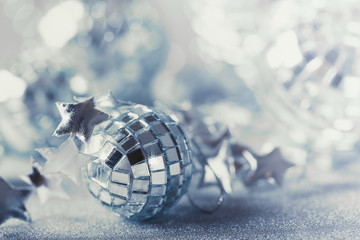 Silver Christmas composition with tiny stars sparkling