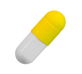 a gelatin capsule with yellow cap isolated on white background, top view