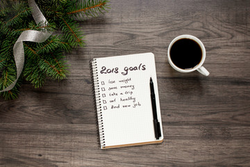 Notebook a cup of coffee and new year's goals