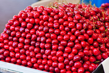 Red cherry on the market. Berries. Vegetable market. Ripe berries
