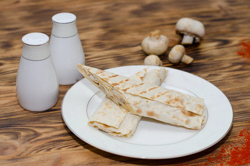 Pita bread with cheese on the plate