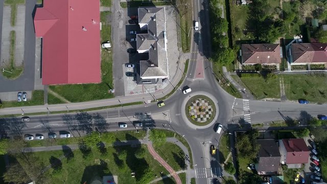 Aerial video of crossroads with circular traffic