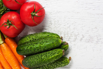 Ripe carrots, tomatoes, cucumbers in the fruit and vegetable market

