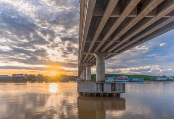 Under the bridge over the river