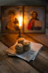 andle against the background of orthodox icons