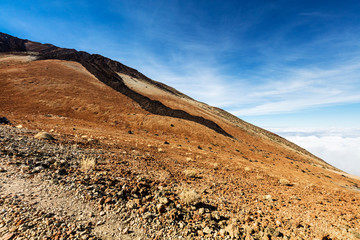 Teide National Park, Tenerife, Canary Islands - colourful soil of the Montana Blanca volcanic ascent trail. This scenic hiking path leads up to the 3718 m Teide Peak, the highest peak in Spain