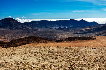 Teide National Park, Tenerife, Canary Islands - colourful soil of the Montana Blanca volcanic ascent trail. This scenic hiking path leads up to the 3718 m Teide Peak, the highest peak in Spain
