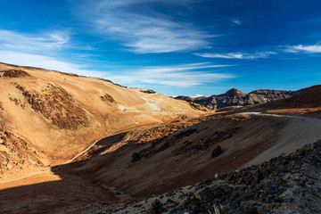 Teide National Park, Tenerife, Canary Islands - colourful soil of the Montana Blanca volcanic ascent trail. This scenic hiking path leads up to the 3718 m Teide Peak, the highest peak in Spain