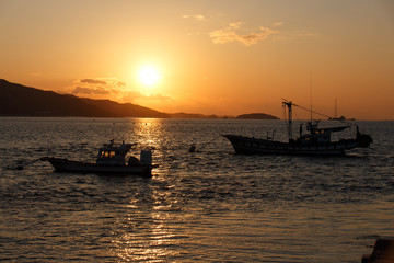 Naklejka premium South Korea West Sea sunset and fishing boat. 