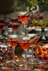 Glass glasses with colored drinks on the table