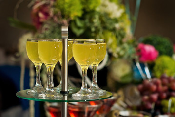 Glass glasses with colored drinks on the table