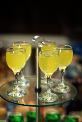 Glass glasses with colored drinks on the table