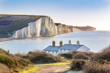 The Coast Guard Cottages and Seven Sisters Chalk Cliffs just outside Eastbourne, Sussex, England,...