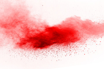 abstract powder splatted background,Freeze motion of red powder exploding/throwing red powder.