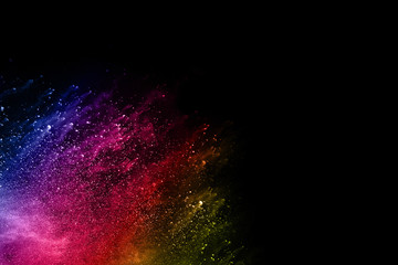 abstract powder splatted background. Colorful powder explosion on black background. Colored cloud. Colorful dust explode. Paint Holi.