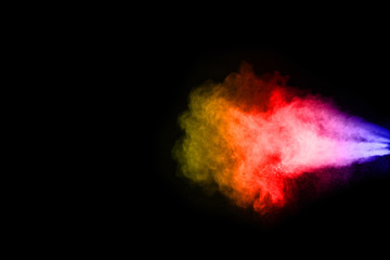 abstract powder splatted background. Colorful powder explosion on black background. Colored cloud....