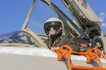 Military pilot in the cockpit of a jet aircraft