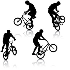 Set silhouette of a cyclist male performing acrobatic pirouettes. vector illustration © Arrows
