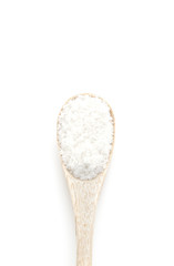 Salt spice in wooden spoon isolated on white