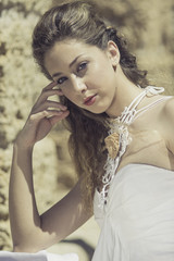 Naklejka premium Portrait of young curly girl in a rural location