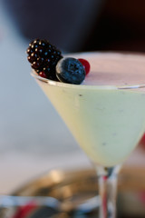 Sweet mousse dessert with berries in a glass