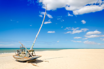 Parked jangada boat over a paradise beach