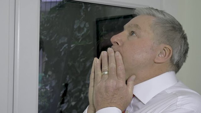 Mature businessman looking worried and apprehensive
