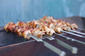 Barbecues grilled on charcoal near the house