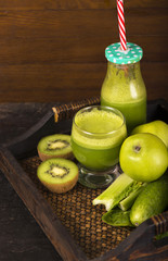 Healthy green smoothie with spinach in a jar mug isolated