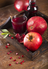 pomegranate juice on a wooden background