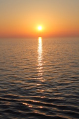 sunset on ocean red orange sinking sun in sea