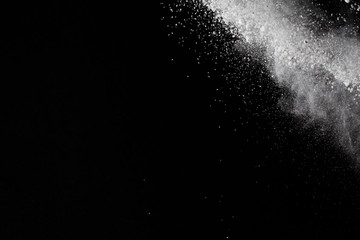 Fototapeta na wymiar White powder. Grainy abstract texture on black background.