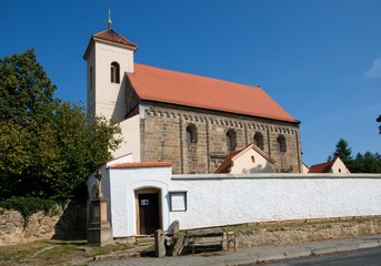 Fototapeta premium Cemetery and romanesque church St. Nicholas in the village Potvorov,Western Bohemia, Czech republic, Europe
