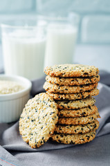 Sesame cookies with glasses of milk